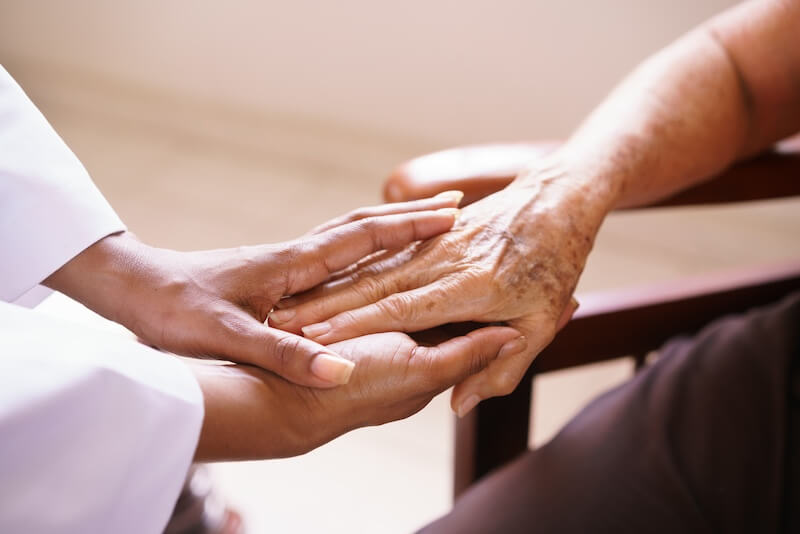 healthcare provider and geriatric patient hands