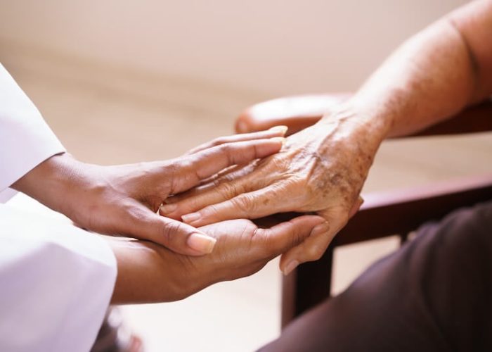 healthcare provider and geriatric patient hands